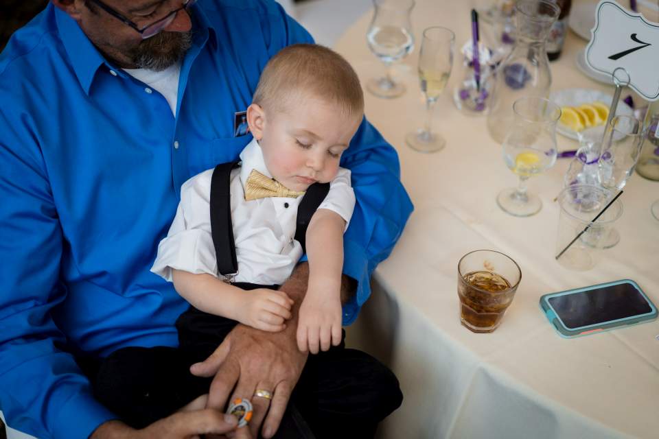 little wedding guest sleeping at table